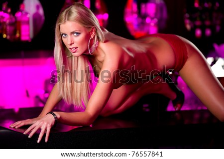 Young seductive woman indoors