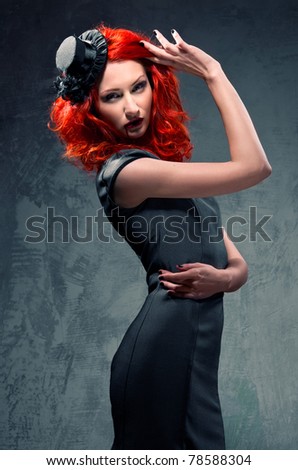 Seductive redhead woman with blood on her lips