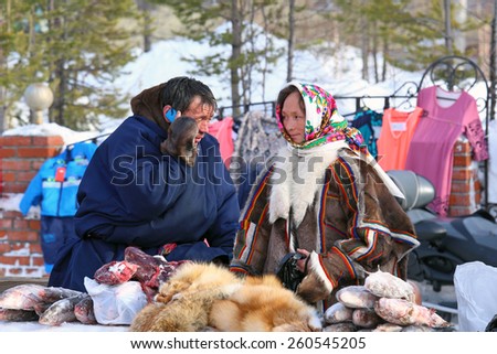 NADYM, RUSSIA - MARCH 14, 2015: Nenets trade in meat of deer and fish on a traditional holiday \