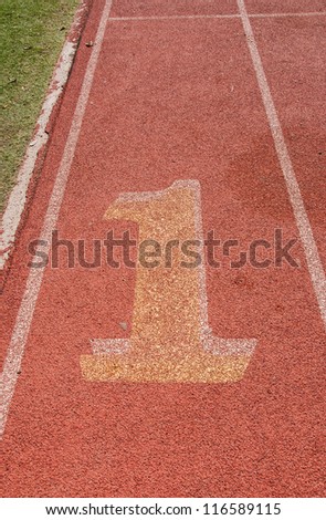 Number one lane on athletic track and field sports track.