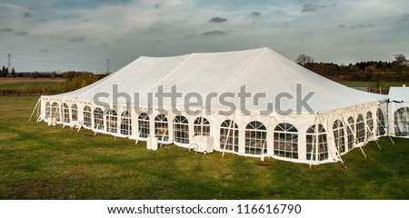 White banquet wedding tent or party tent at twilight time