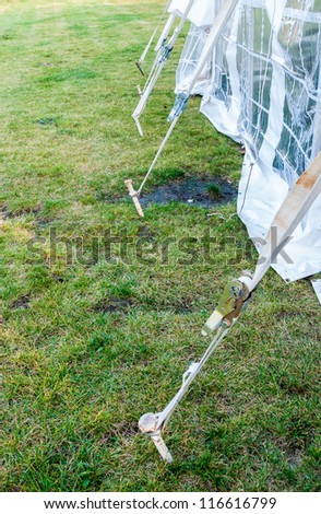 Tent stakes also known as tent pegs are wrapped and tied with white rope set