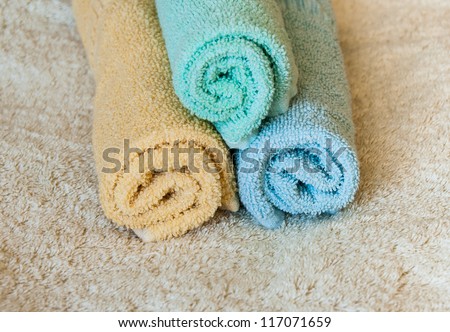 Rolled up multi color soft and fresh spa towels.Wellness objects.
