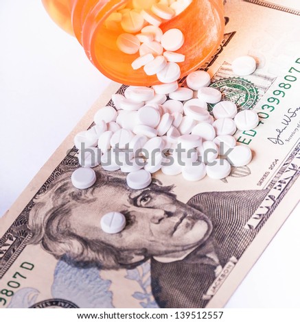 Rising cost of health care with spilled medicine. Drug abuse. Addiction.