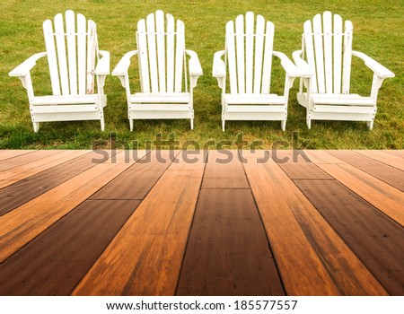 Hardwood floor in a room with Adirondack chair background