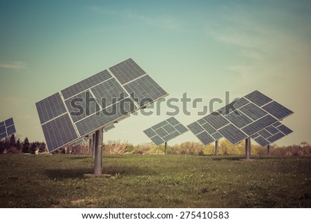 Clean image of commercial Solar plant on a prairie generating clean electric power