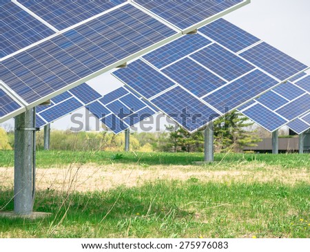 Clean image of commercial Solar plant on a prairie generating clean electric power