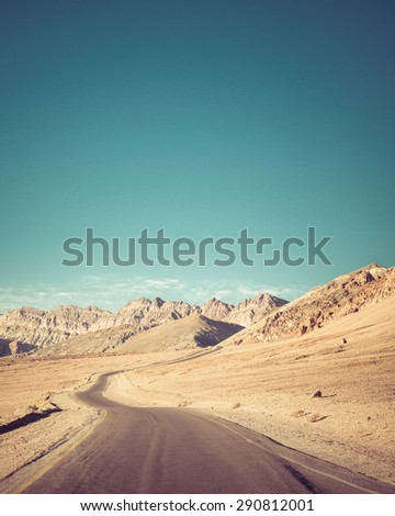 Open road to inspirational Artists Point drive  at Death Valley national Park.Artistic Instagram style processing.