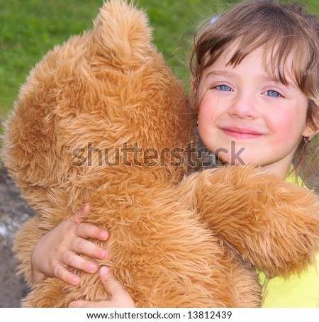 Child Holding Bear