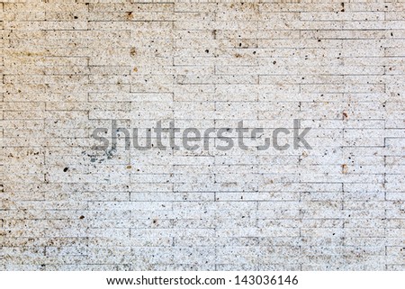 The background image of the pattern of the aged white stone wall