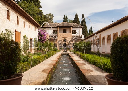Water feature and gardens of the Generalife inside the Alhambra palace of Granada