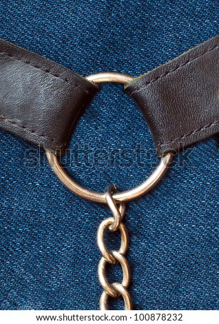 Strap with a chain on denim
