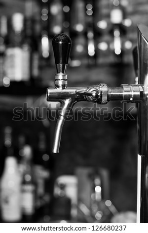 Beer tap at the bar in black and white