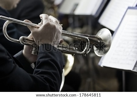 Hands of the man playing the trumpet