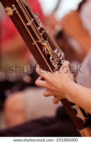 Bassoon in the hands of a musician closeup