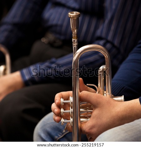 Trumpet in the hands of a musician