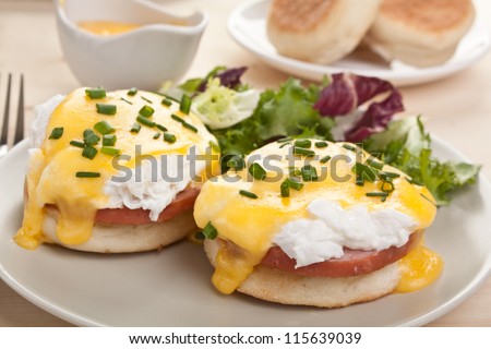 Eggs Benedict- Toasted English Muffins, Ham, Poached Eggs, And Delicious Buttery Hollandaise Sauce