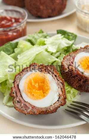 Scotch eggs- free range organic boiled eggs in a layer of sausage meat wrapped in streaky bacon coated in crispy bread crumbs and fried in vegetable oil
