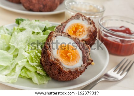 Scotch eggs- free range organic boiled eggs in a layer of sausage meat wrapped in streaky bacon coated in crispy bread crumbs and fried in vegetable oil