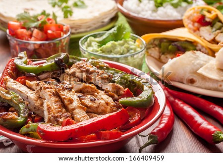Traditional Mexican Food: Cilantro And Lime Rice, Chicken Fajitas, Fajita Peppers, Burritos, Tortillas, Guacamole And Salsa