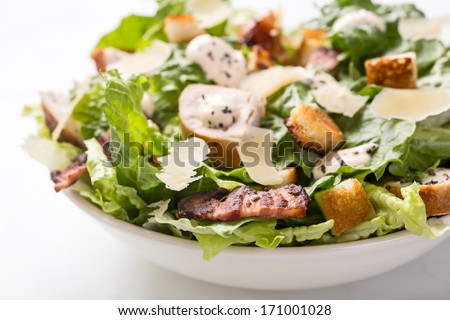Bowl of Traditional Caesar Salad with Chicken and Bacon