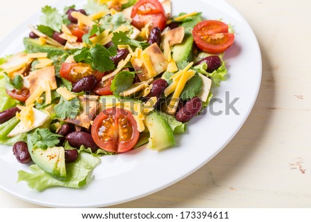 Serving of Mexican Salad with Avocado, Black Beans and Tortilla Croutons