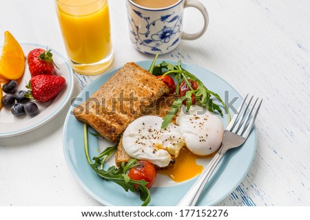 Healthy Breakfast : Poached Eggs, Wholegrain Bread, Orange Juice, Fruit And Vegetables