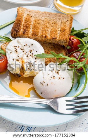 Healthy breakfast : Poached Eggs, Wholegrain Bread, Orange Juice, Fruit and Vegetables
