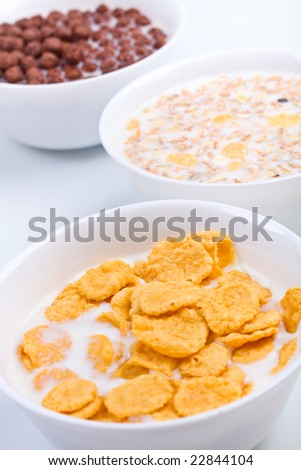 Three bowls of different cereal - family breakfast