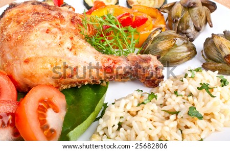 roasted chicken leg with rice and vegetables