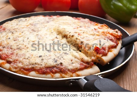 Pizza margarita in a frying pan