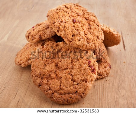 big pile of cookies on wooden table