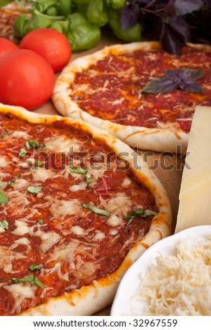 couple pizzas and ingredients