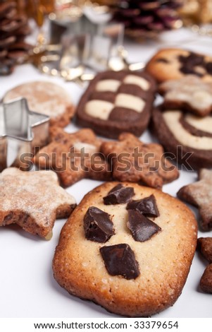 big pile of various cookies with pine cones and christmas decorations