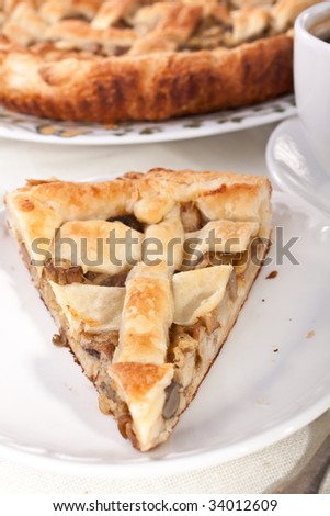 piece of mushroom pie close up and coffee