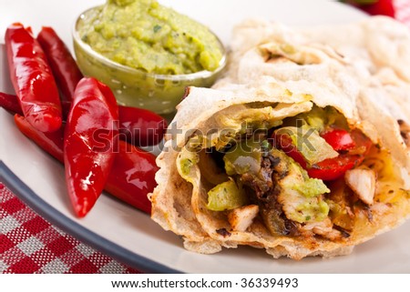 traditional mexican chicken and beef fajitas with guacamole