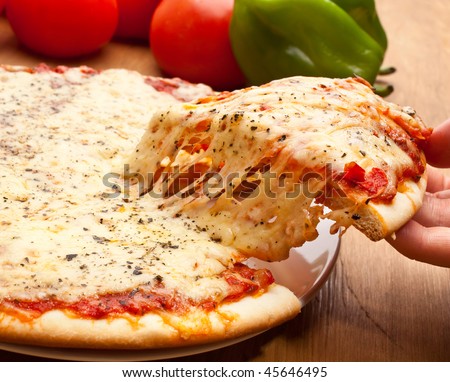 .. أطلب صوره من الي بعدك ..  Stock-photo-slice-of-pizza-margarita-lifted-up-45646495