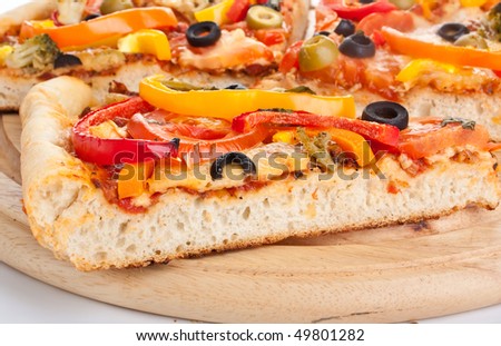 vegetable pizza cut into slices