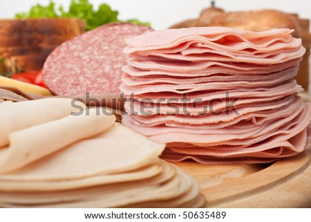 big group of meat, bread and vegetables