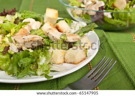 plate of traditional caesar salad with chicken