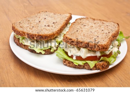 egg salad sandwiches on brown toasted bread