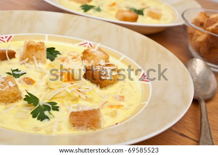 serving of cheese and vegetable cream soup