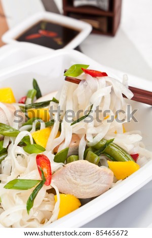 Serving of oriental warm noodle chicken salad