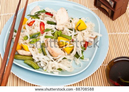 Serving of oriental warm noodle chicken salad