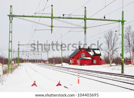Red train station with snow