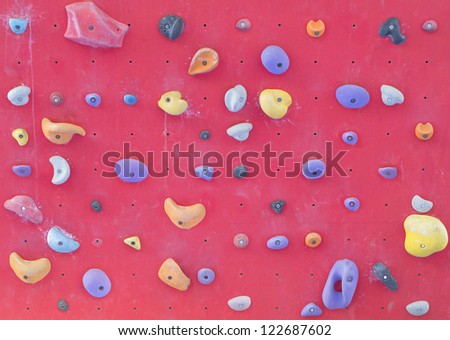 Rock climbing wall with toe and hand hold studs.