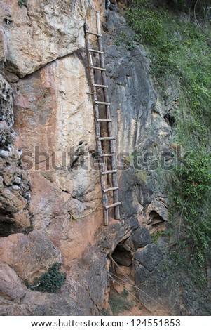 Old ladder on a rock cliff