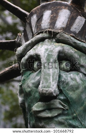 NEW YORK CITY - MAY 1 : Occupy Wall Street\'s own Statue of Liberty in close up at Bryant Park just before the march in honor of International Workers\' Day  on May 1 2012 in New York City.