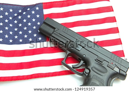 American Firearm/Autoloader handgun laying on US flag