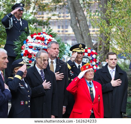 NEW YORK CITY - NOVEMBER 11 2013: Veterans' Day was marked by a ceremonial wreath laying at the Eternal Light Monument in Madison Square Park & parade on Fifth Avenue November 11 2013 in New York City